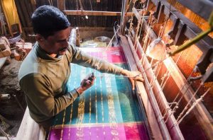 Weaver making sari